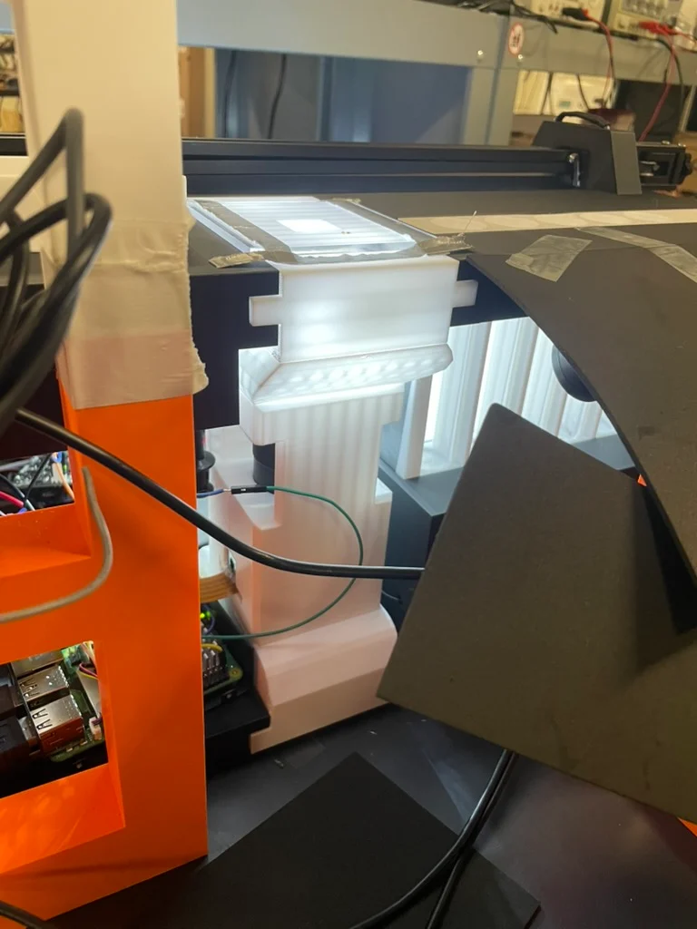 Integrated magnified imaging chamber and illumination